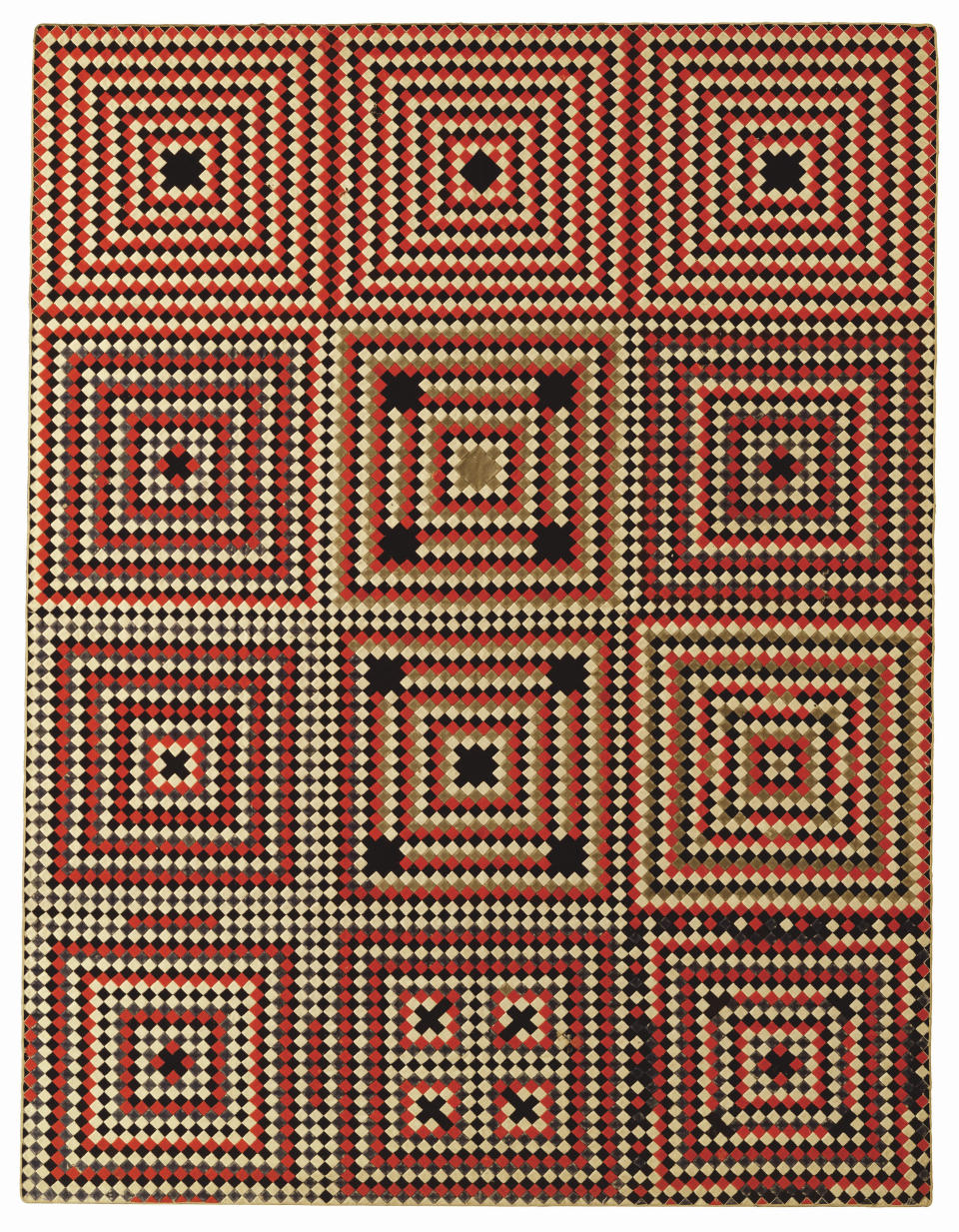 This image provided by the American Folk Art Museum shows the Soldier's Quilt: Square Within a Square. It's made of the thick red, yellow and black wool used in military uniforms, and curators say the tight geometric motif of small squares was similar to woodworking patterns, perhaps an allusion to an activity considered masculine.(American Folk Art Museum via AP)