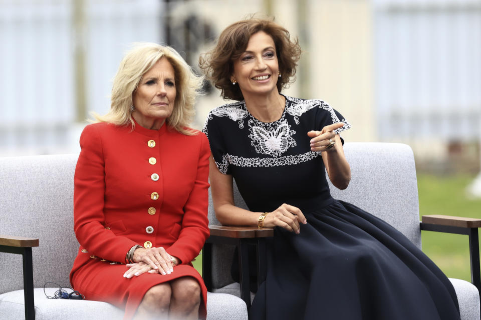 First Lady Jill Biden, left, and Unesco Director General Audrey Azoulay attend a ceremony at the UNESCO headquarters Tuesday, July 25, 2023 in Paris. U.S. first lady Jill Biden is in Paris on Tuesday to attend a flag-raising ceremony at UNESCO, marking Washington's official reentry into the U.N. agency after a five-year hiatus. (AP Photo/Aurelien Morissard, Pool)