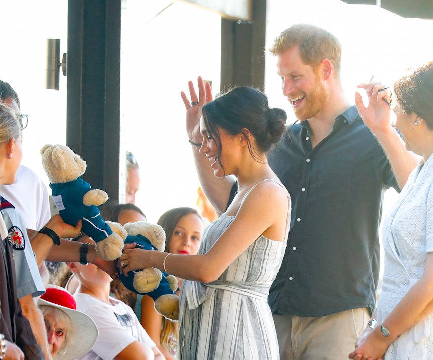 Meghan accepts teddy bears from a royal fan. Photo: Getty