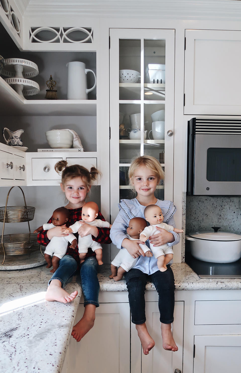 Mila and Emma holding their baby dolls. (Photo courtesy of K.C. Stauffer)