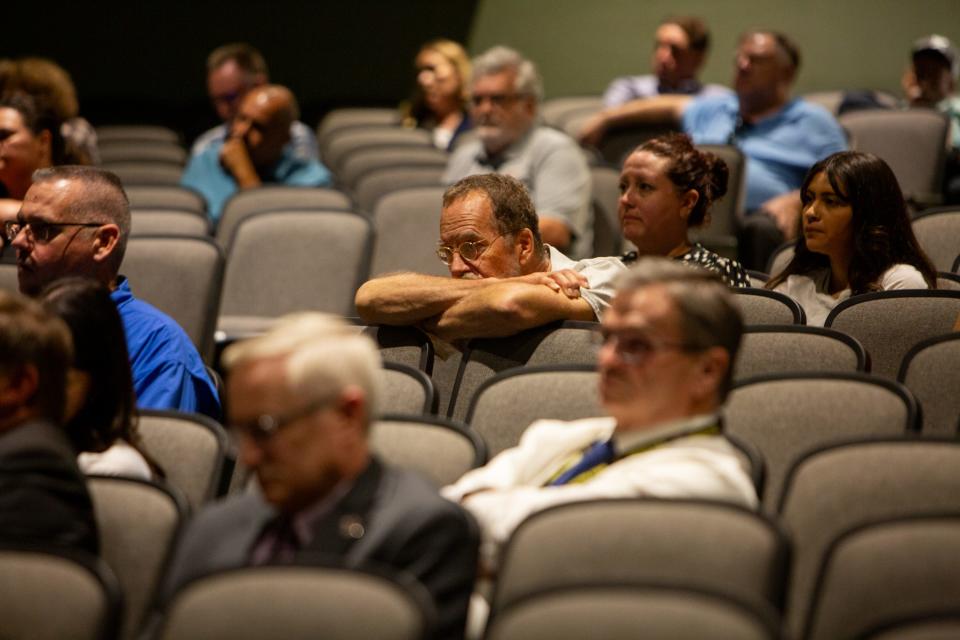 Gila County residents listen during a town hall held by Gila County Community College administrators inside the Globe High School auditorium in Globe on Tuesday, July 25, 2023.