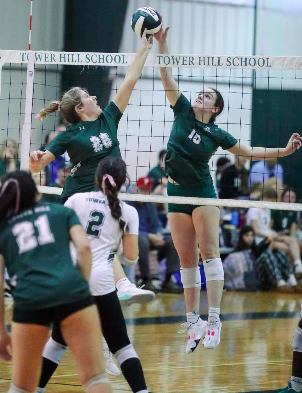 Archmere's Claire McGonigle (18) and Tower Hill's Lydia Spencer (26) come together at the net in the first set of Tower Hill's 3-1 win, Tuesday, Oct. 24, 2023 at Tower Hill School.