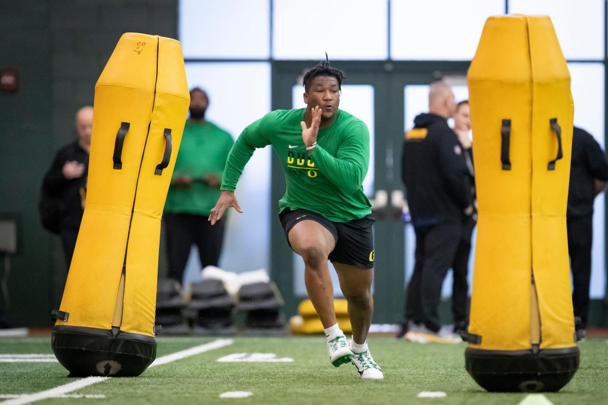 Oregon defensive end Brandon Dorlus runs drills during Oregon Pro Day Tuesday, March 12, 2024 at the Moshofsky Center in Eugene, Ore.