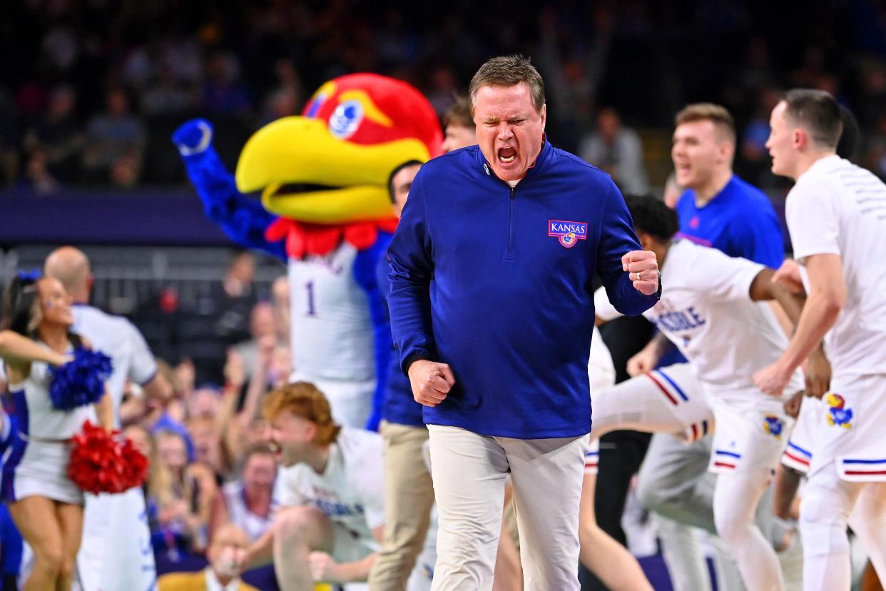 Kansas Jayhawks head coach Bill Self and the bench reacts after a play against the North Carolina Tar Heels during the second half.
