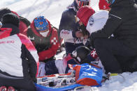 United States' Marin Hamill is taken off the course by medical staff after a crash during the women's slopestyle qualification at the 2022 Winter Olympics, Monday, Feb. 14, 2022, in Zhangjiakou, China. (AP Photo/Francisco Seco)