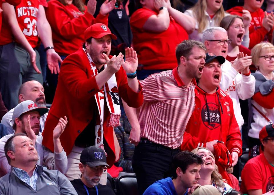 Fans cheer the Wolfpack during the first half of N.C. State’s game against Creighton in the first round of the NCAA Tournament at Ball Arena in Denver, Colo., Friday, March 17, 2023. Ethan Hyman/ehyman@newsobserver.com