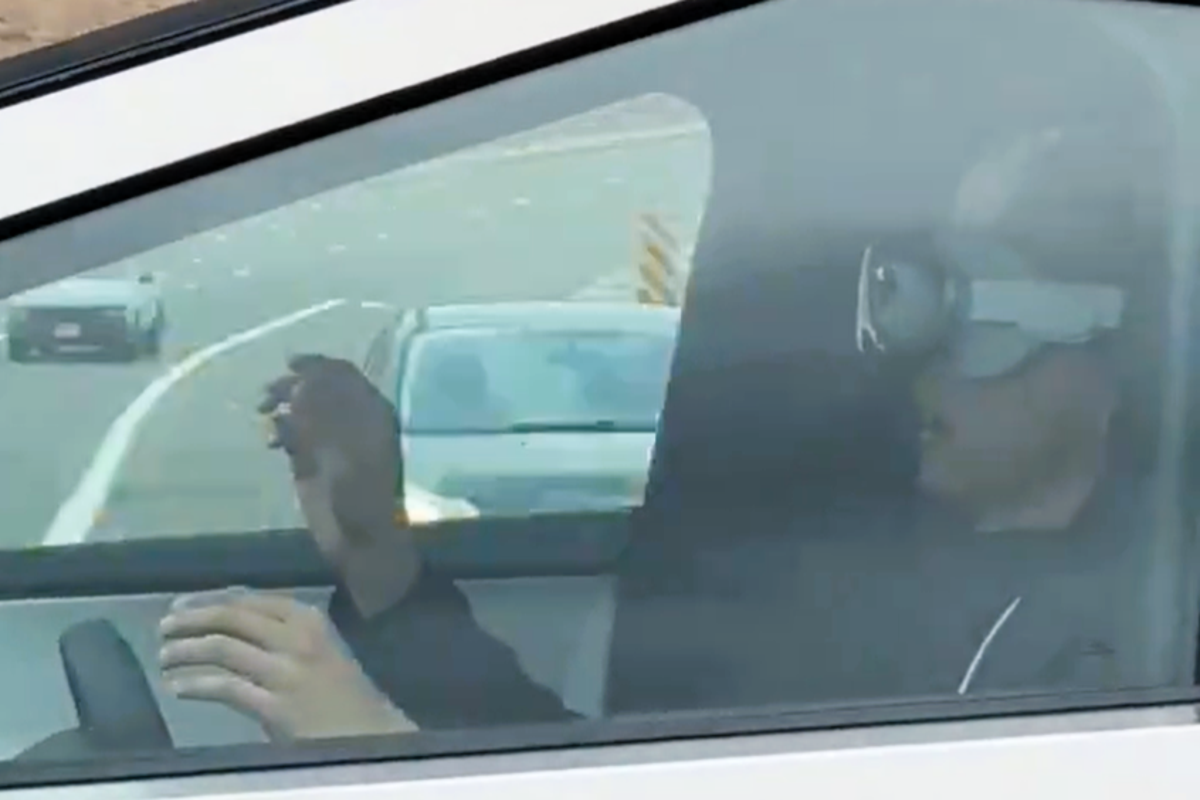 A video posted to X on 5 February appears to show a driver of a Tesla Cybertruck wearing an Apple Vision Pro headset (Screenshot/ X)