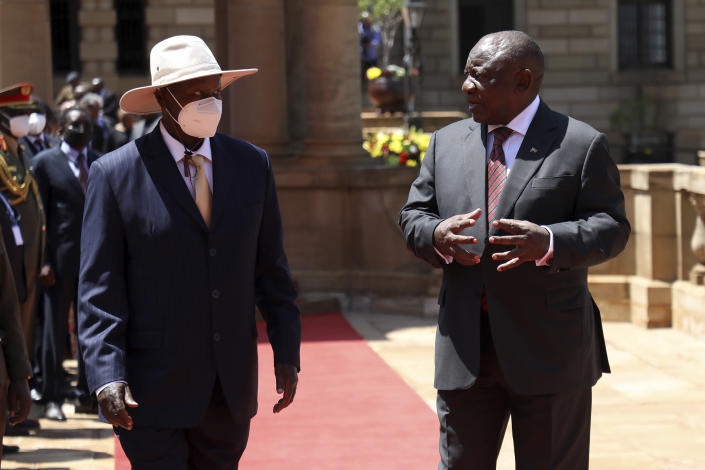 Ugandan President Yoweri Museveni, left, and his South African counterpart Cyril Ramaphosa meet during a welcoming ceremony in Pretoria, South Africa, Tuesday, Feb. 28, 2023. Museveni's visit is directed at consolidating bilateral relations between the two countries, with discussions between the two Heads of State encompassing political, economic, regional, continental and international issues. (AP Photo)