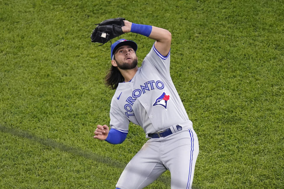 Toronto Blue Jays shortstop Bo Bichette catches a popup by Chicago White Sox's Yoan Moncada to end the third inning of a baseball game Wednesday, June 9, 2021, in Chicago. (AP Photo/Charles Rex Arbogast)