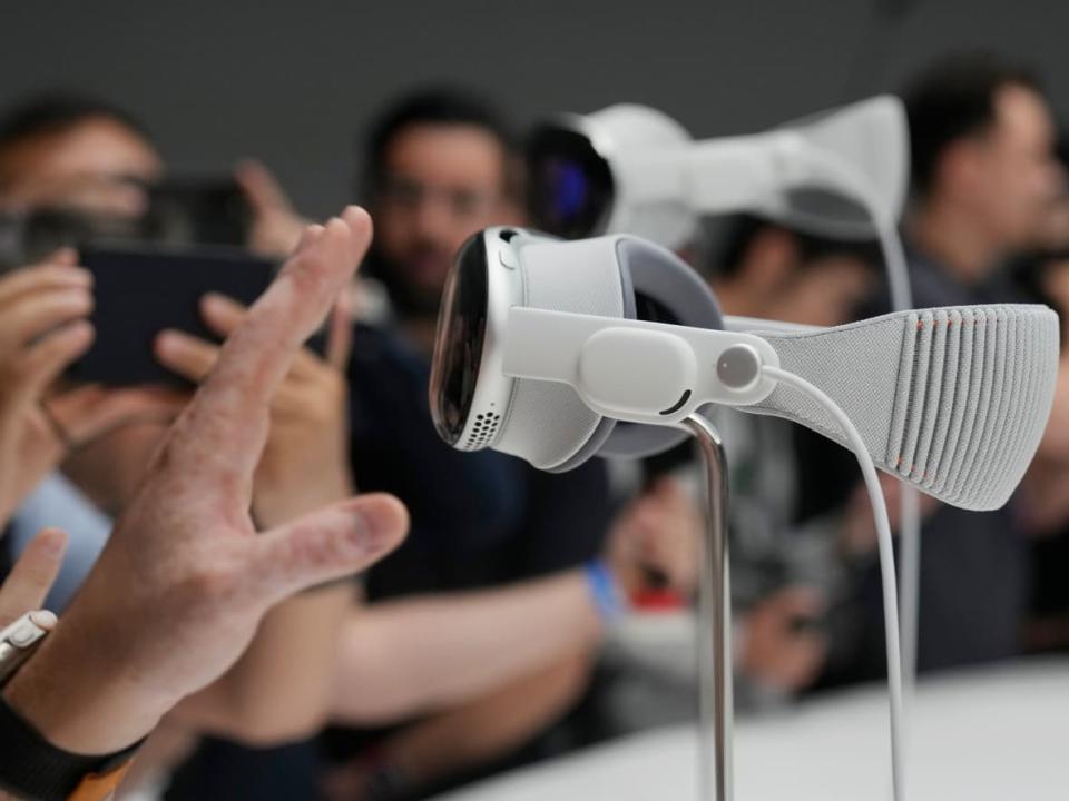 The Apple Vision Pro headset is displayed in a showroom on the Apple campus Monday, June 5, 2023, in Cupertino, Calif.  (Jeff Chiu/The Associated Press - image credit)