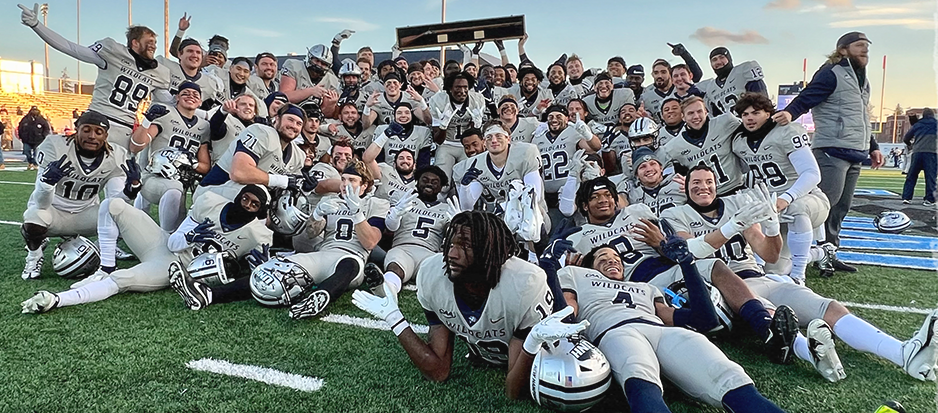 Members of the University of New Hampshire football team celebrate Saturday's 42-41 win at Maine. With the win, the Wildcats earned a share of the Colonial Athletic Association championship. The field for the 24-team FCS playoffs will be announced Sunday at 12:30 p.m.