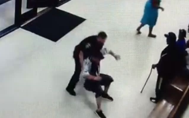 Surveillance video released by police shows a deputy wrestling Joseph Hutchenson to the ground.