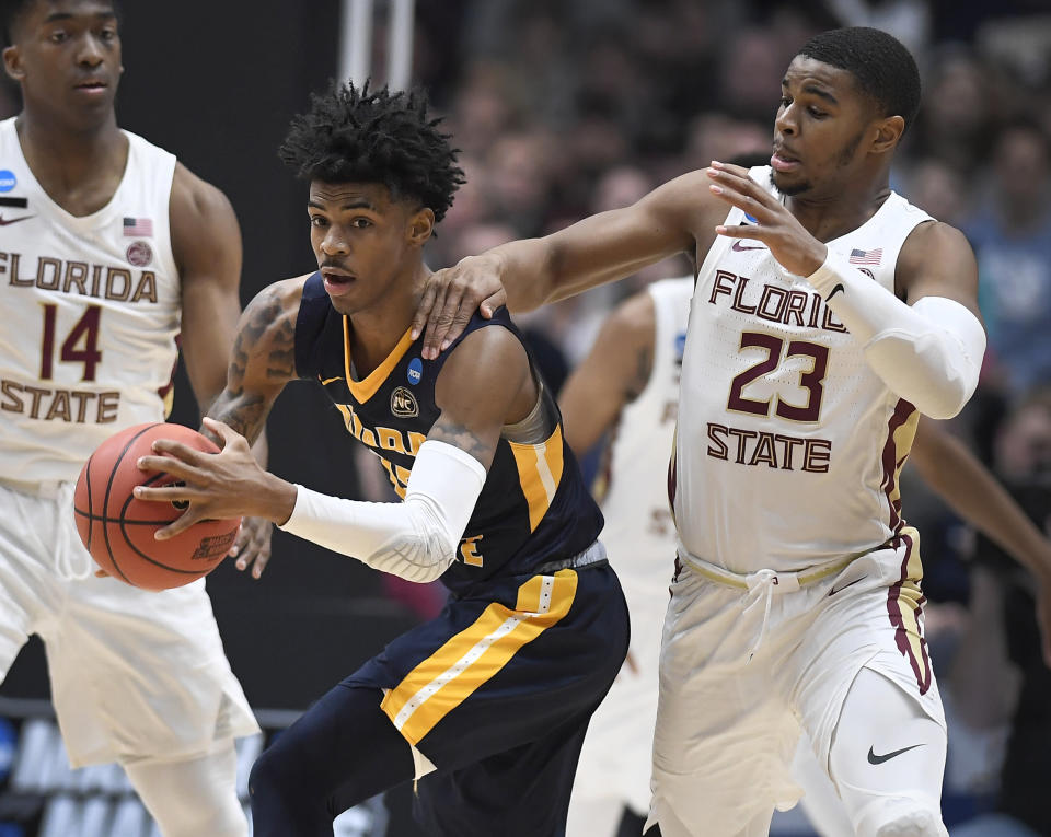 Florida State's M.J. Walker, right, fouls Murray State's Ja Morant, left, during the first half of a second round men's college basketball game in the NCAA tournament, Saturday, March 23, 2019, in Hartford, Conn. (AP Photo/Jessica Hill)