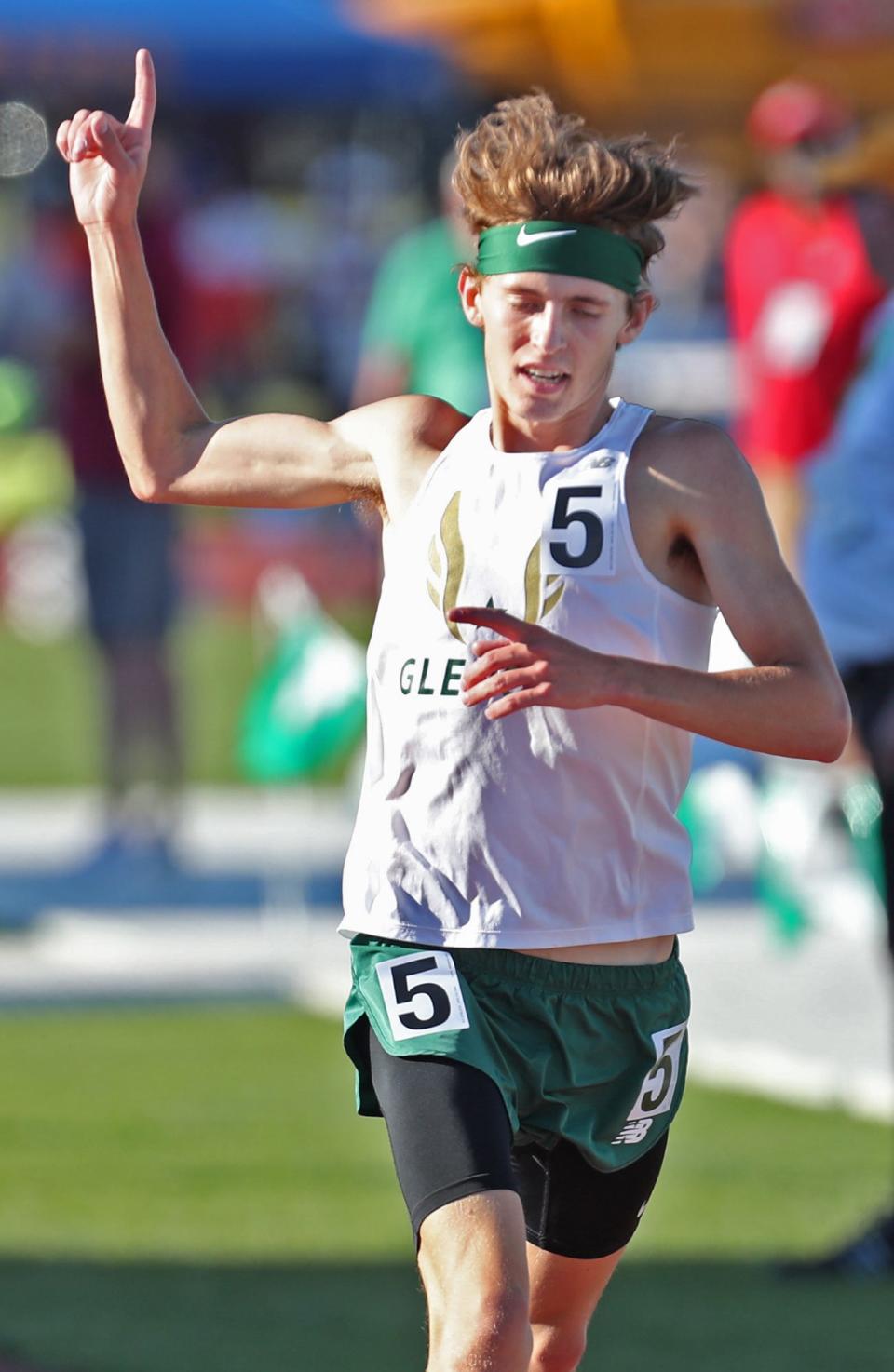 GlenOak's Thomas Rice celebrates his victory in the boys 3200 meter run at the Division I state track and field championships at Jesse Owens Stadium in Columbus in 2022.