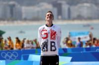 2016 Rio Olympics - Triathlon - Men's Victory Ceremony - Fort Copacabana - Rio de Janeiro, Brazil - 18/08/2016. Alistair Brownlee (GBR) of Britain reacts on the winners' podium. REUTERS/Damir Sagolj