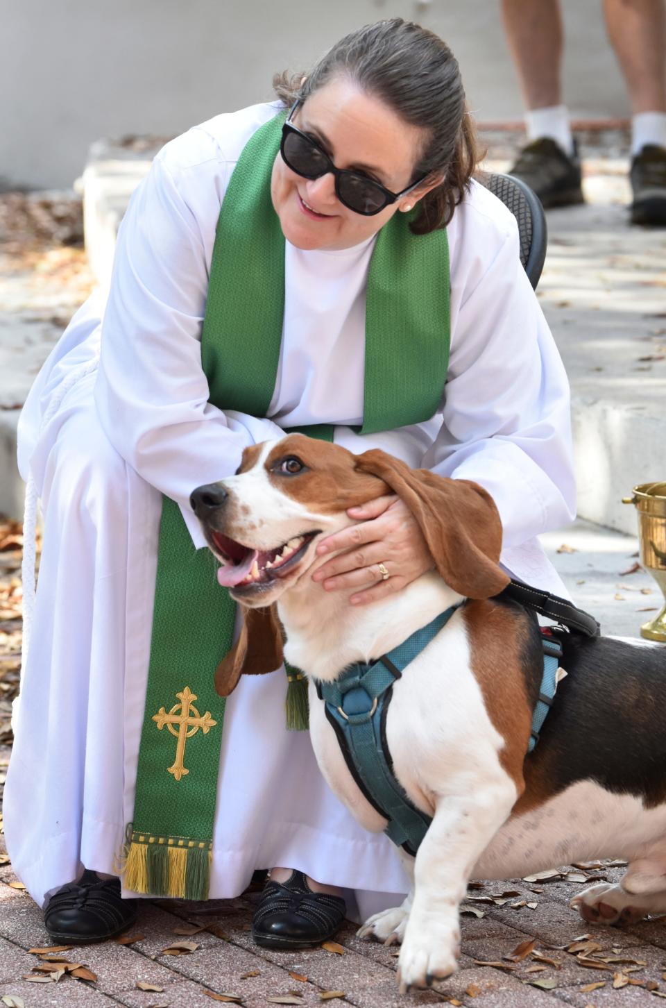 Reverend Sara Oxley officiates the annual Blessing of the Animals at the Myrt Tharpe Gazebo in Cocoa Village.