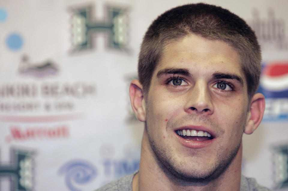 FILE - In this Dec. 5, 2007, file photo, then-Hawaii quarterback Colt Brennan speaks to the media after being named a Heisman Trophy finalist, in Honolulu. Brennan, a star quarterback at the University of Hawaii who finished third in the 2007 Heisman Trophy balloting, died early Tuesday, May 11, 2021, his father said. He was 37. Brennan, who has had public struggles with alcohol, died at a hospital in California, his father, Terry Brennan, told The Associated Press. (AP Photo/Marco Garcia, File)