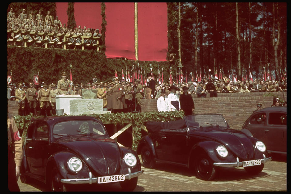 <i>Hitler speaks at a ceremony celebrating the laying of the cornerstone for the Fallersleben Volkswagen works near Wolfsburg, Germany, on June 25, 1938.</i>