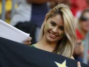 A fan waits for the start of the 2014 World Cup Group G soccer match between Portugal and Ghana at the Brasilia national stadium in Brasilia June 26, 2014. REUTERS/Jorge Silva (BRAZIL - Tags: SOCCER SPORT WORLD CUP)