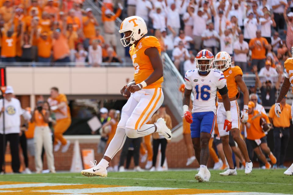 Tennessee quarterback Hendon Hooker runs for a touchdown during the first half against the Florida Gators.