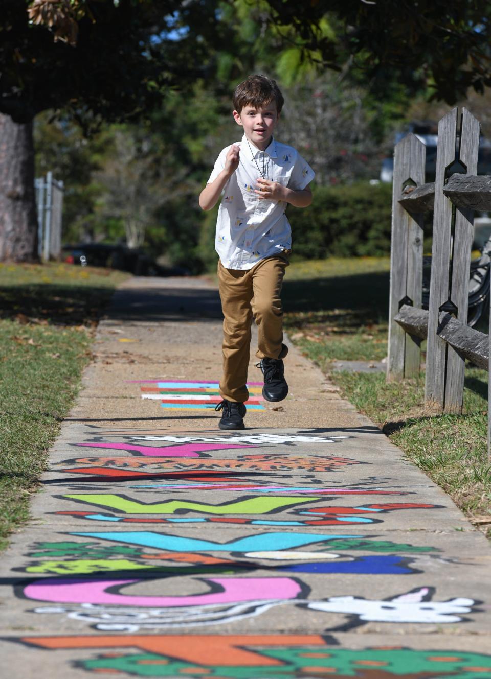 Trey McWilliams, 6, runs down the new Born Learning Trail at Bayview Park in Pensacola on Tuesday, Oct. 24, 2023. This newest Born Learning Trail was created by the Pensacola News Journal in association with Ready Kids!, the United Way of West Florida, and the Sunstone Project.