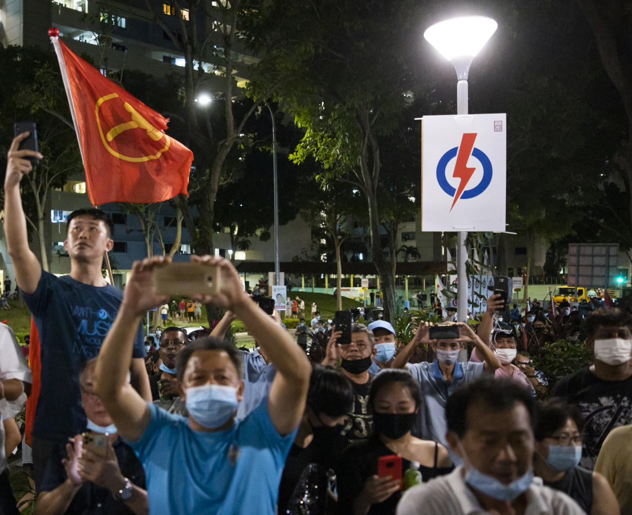 Residents gathering at Hougang Avenue 5 in the early hours of 11 July, 2020, hours after the GE2020 polls have ended. (PHOTO: Don Wong/Yahoo News Singapore)