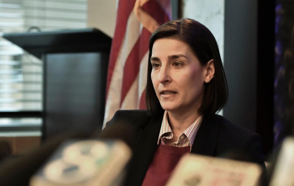 Assistant Attorney General Christina Grossi answers questions, Friday, Dec. 21, 2018, during a press conference regarding the independent Special Counsel's investigation into MSU's handling of the Larry Nassar matter.  [AP Photo/Matthew Dae Smith/Lansing State Journal]