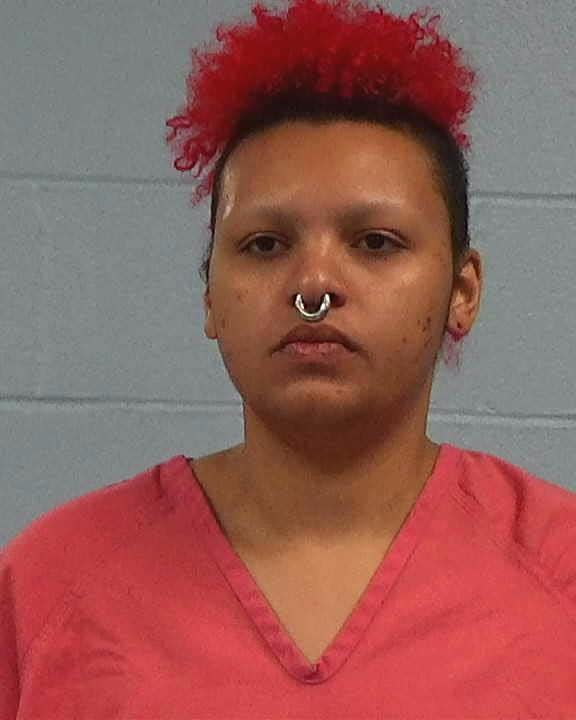 Indira Kamil Zink, 25, of Austin, has been charged with murder in the stabbing death of Robert Joseph St. John Jr.