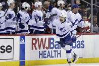 Tampa Bay Lightning left wing Brandon Hagel (38) celebrates with teammates after scoring a goal against the New Jersey Devils during the second period of an NHL hockey game Tuesday, March 14, 2023, in Newark, N.J. (AP Photo/Adam Hunger)