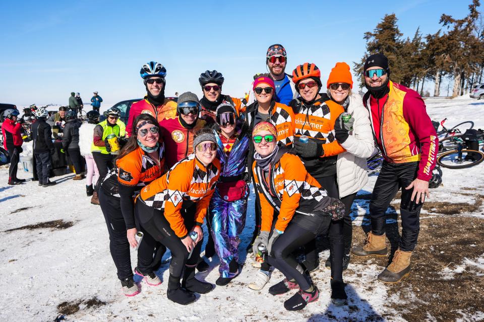 Team Jackhammer and Team Petting Zoo pose for a photo at a bonfire between Perry and Rippey during the 46th Annual BRR Ride on Saturday, Feb. 4, 2023.