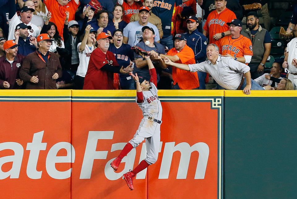 Jose Altuve was ruled out on fan interference when Mookie Betts reached over the wall to make a play on his ball. (Getty)