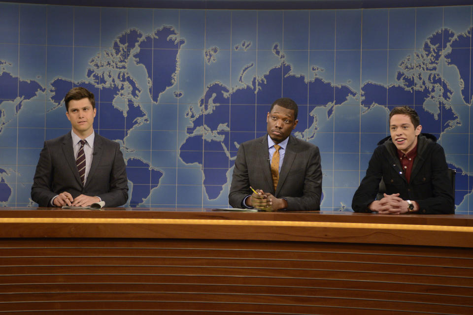 Colin Jost, Michael Che and Pete Davidson as the show's resident young person during the "Weekend Update" skit on September 27, 2014