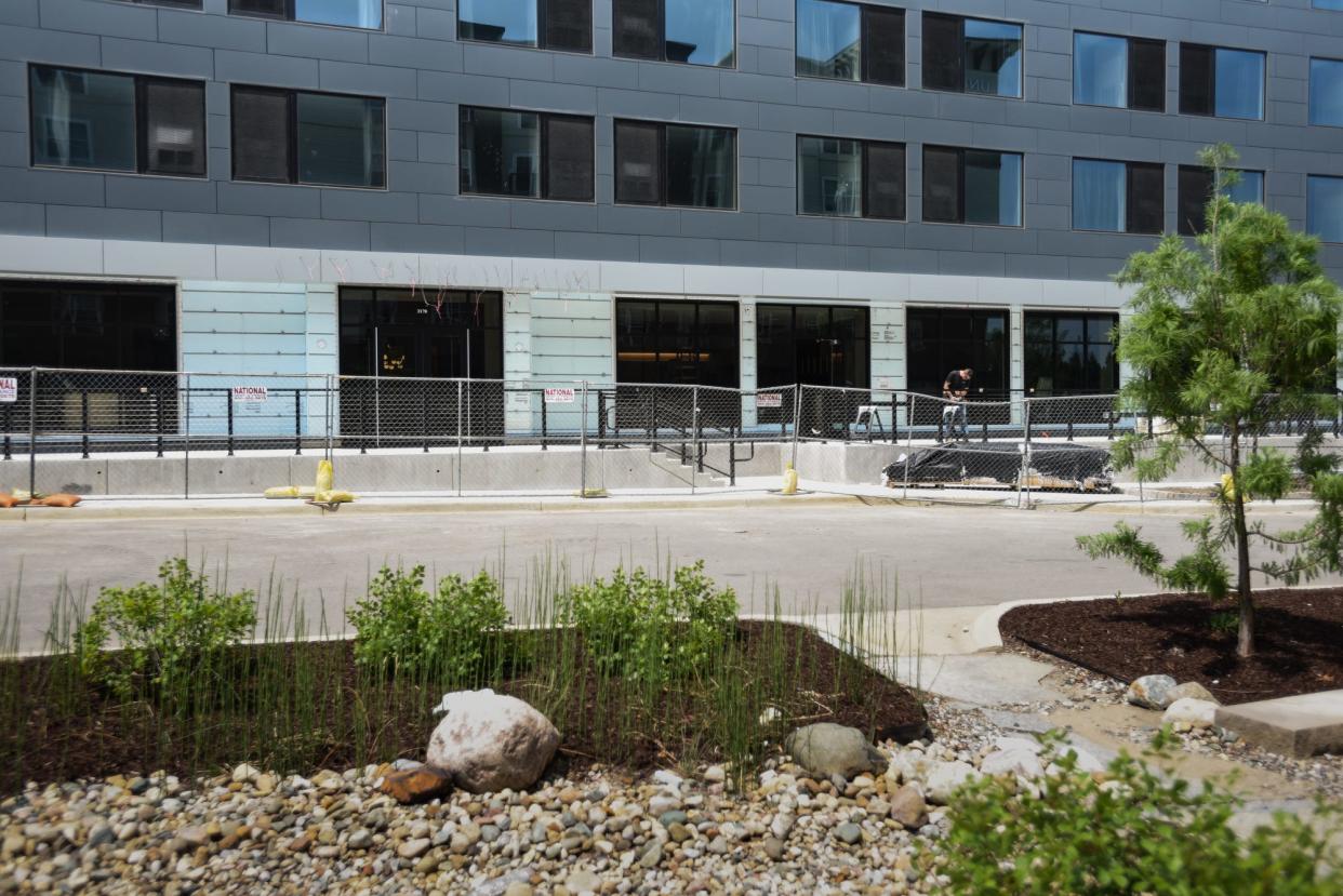 A worker seen Friday, June 30, 2023, at the Red Cedar Development site on the east side of the future Marriott AC Hotel under construction. The lower level will house the upscale Italian restaurant Toscana.