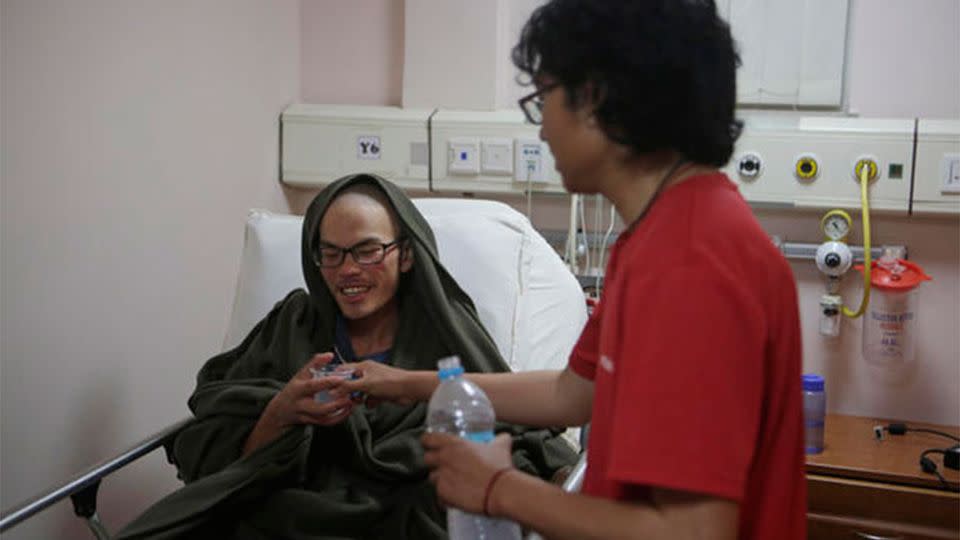 Liang Sheng-yueh was rescued, weighing nearly 30 kilograms less than when he set out on the hike on March 10. Source: AP