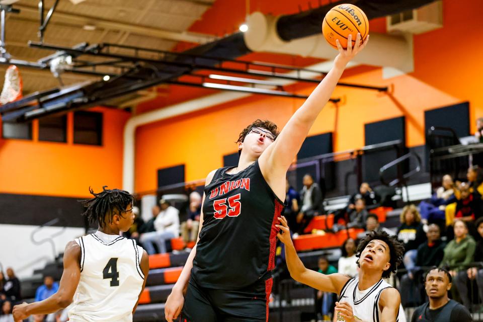 Union’s Erik Madrid (55) reaches for a rebound during a Putnam City Invitational Boys Basketball game between Union and Midwest City in Oklahoma City, on Friday, Jan. 5, 2024.