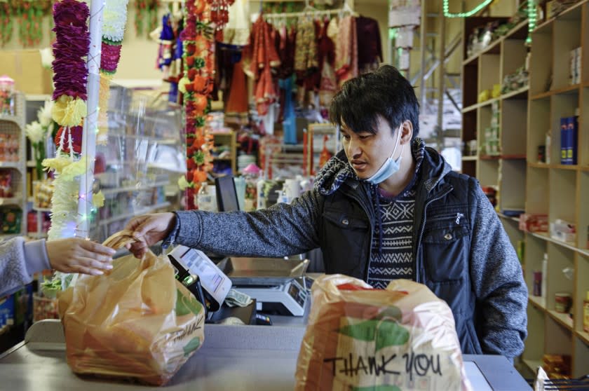 FARGO, N.D. - APRIL 13, 2021: Shankar Subba manages his family-owned Himalayan Grocery store in Fargo, N.D. Subba runs the store with his father Padam Sing Subba, and his brother Ajit.