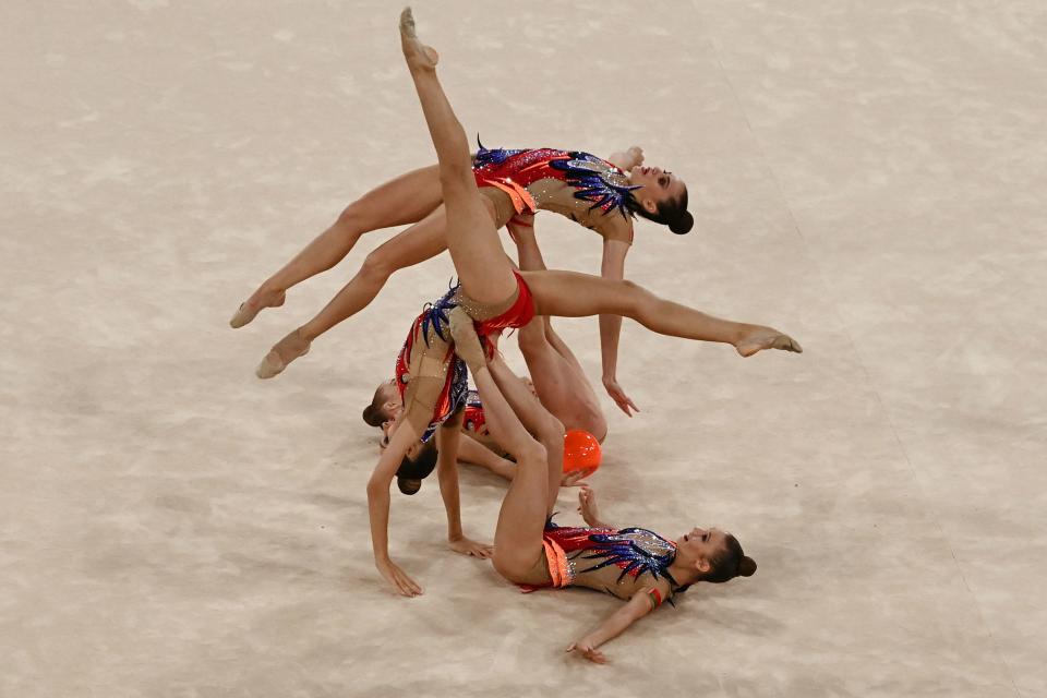 <p>Team Belarus competes in the group all-around final of the Rhythmic Gymnastics event during Tokyo 2020 Olympic Games at Ariake Gymnastics centre in Tokyo, on August 8, 2021. (Photo by Martin BUREAU / AFP)</p> 