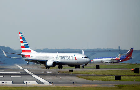 FILE PHOTO: An American Airlines jet taxis on the runway at Washington National Airport in Washington, U.S., August 9, 2017. REUTERS/Joshua Roberts/File Photo