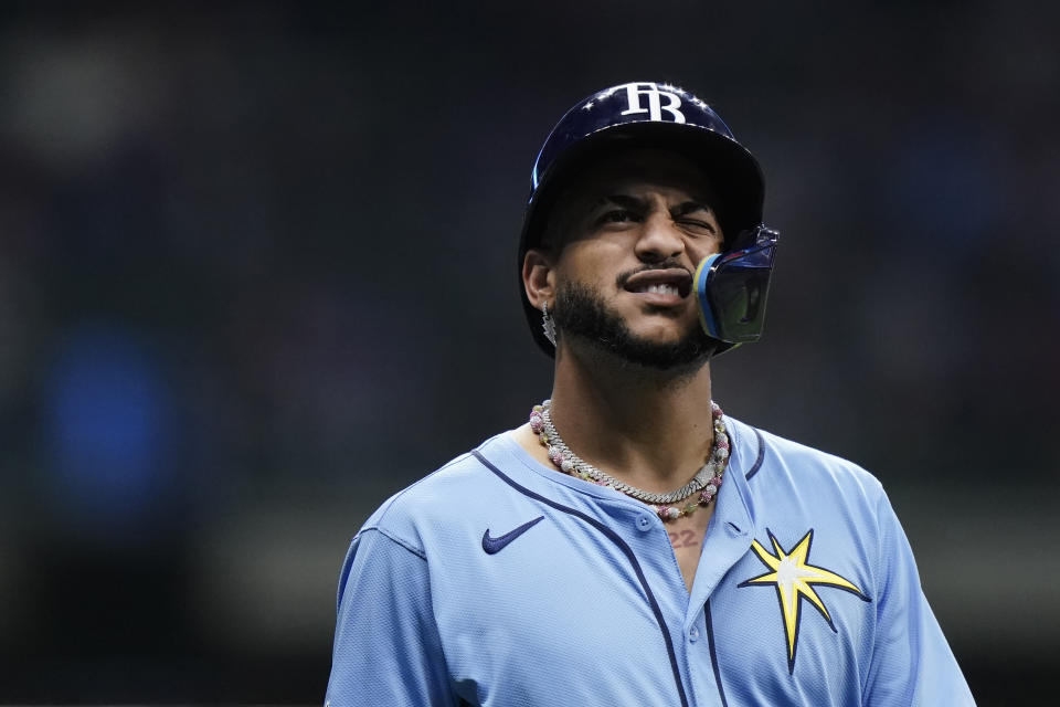 Tampa Bay Rays' Jose Siri reacts after being hit by a pitch during the sixth inning of a baseball game against the Milwaukee Brewers Tuesday, April 30, 2024, in Milwaukee. (AP Photo/Aaron Gash)