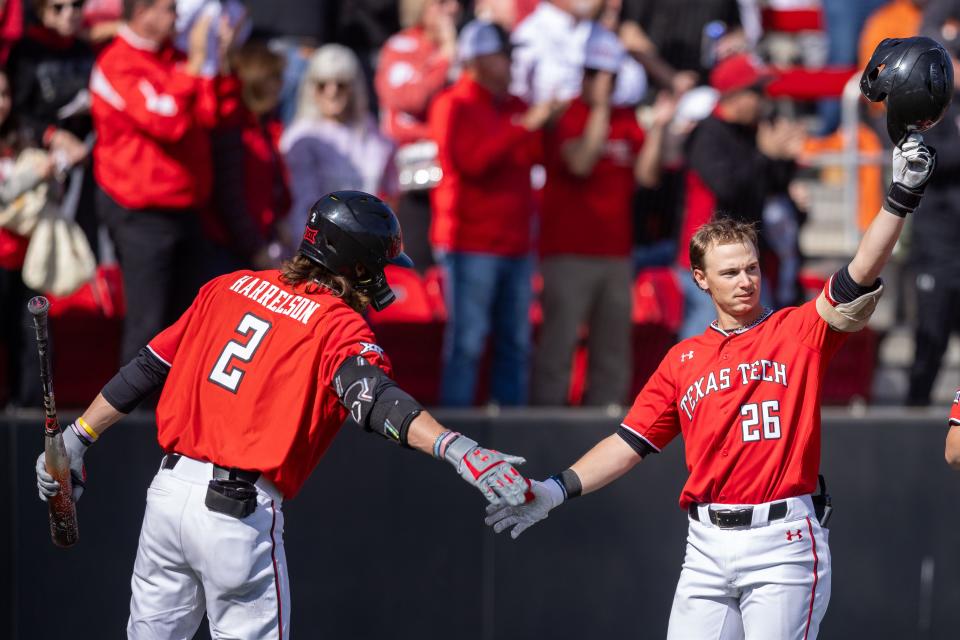 Texas Tech catcher Dylan Maxcey (26) celebrates a home run with outfielder Gage Harrelson (2) in game two of the Big 12 baseball series against Texas, Saturday, March 9, 2024, at Rip Griffin Park.