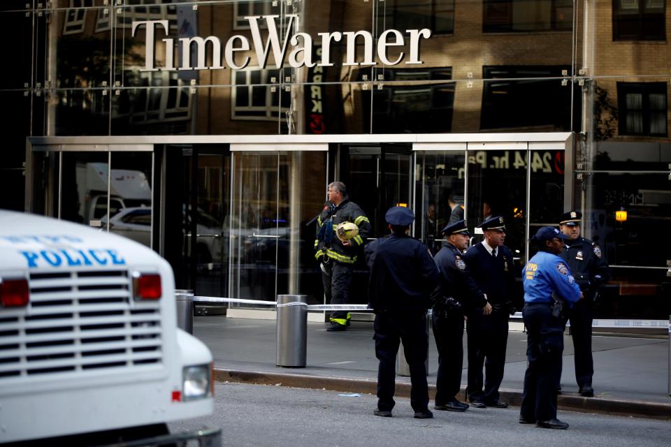 NEW YORK, USA - OCTOBER 24: Police officers take security measures in front of the Time Warner Building where a suspected explosive device was found in the building after it was delivered to CNN's New York bureau in New York, United States on October 24, 2018. Explosive devices were also found near the home of former US Presidents Bill Clinton and Barack Obama in New York. (Photo by Atilgan Ozdil/Anadolu Agency/Getty Images)