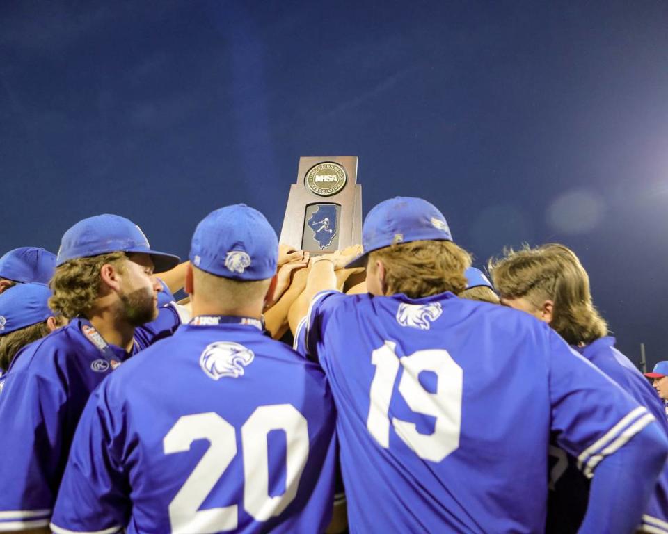 Columbia players raise the second place trophy after suffering a 4-2 loss in Saturday’s IHSA Class 2A state championship game against Joliet Catholic Academy at Dozer Park in Peoria. The Eagles finished their tremendous season at 34-5.