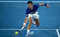 Novak Djokovic struck back for the old guard at the Australian Open on Monday, soaking up the pressure from a willing Daniil Medvedev before battling to a 6-4, 6-7, 6-2, 6-3 win to reach his 10th quarter-final at Melbourne Park.