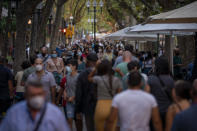 Spain’s GDP contracted 18.5 per cent in the second quarter, wiping out all the recovery the country had made post the 2008-2013 financial crisis. This has come after the 5.2 per cent drop in the first quarter. <br>The country imposed one of Europe's toughest lockdown measures on March 15, as it grappled with the virus – while this helped reduce the death rate, it has had a devastating impact on the economy, with industries such as tourism being badly hit. <br><br><em><strong>Image:</strong></em> People wearing face masks walk along a boulevard in Barcelona, Spain on Sunday, Aug. 30, 2020. Spanish authorities have announced new restrictions to prevent COVID-19. (AP Photo/Emilio Morenatti)