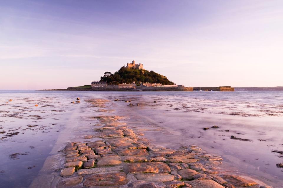 A view of St Michael’s Mount, with part of the path covered by the tide (Getty Images/iStockphoto)