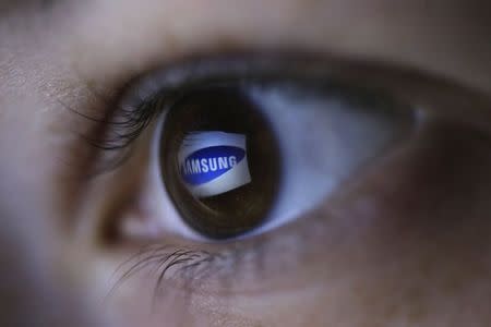 A picture illustration shows Samsung's logo reflected in a person's eye, in central Bosnian town of Zenica, March 13, 2015. REUTERS/Dado Ruvic