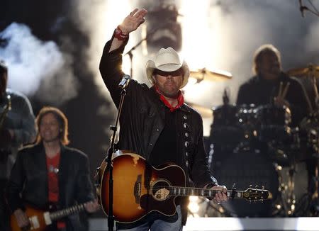 Toby Keith waves after performing "Shut Up and Hold On" at the 49th Annual Academy of Country Music Awards in Las Vegas, Nevada in this file photo taken April 6, 2014. REUTERS/Robert Galbraith