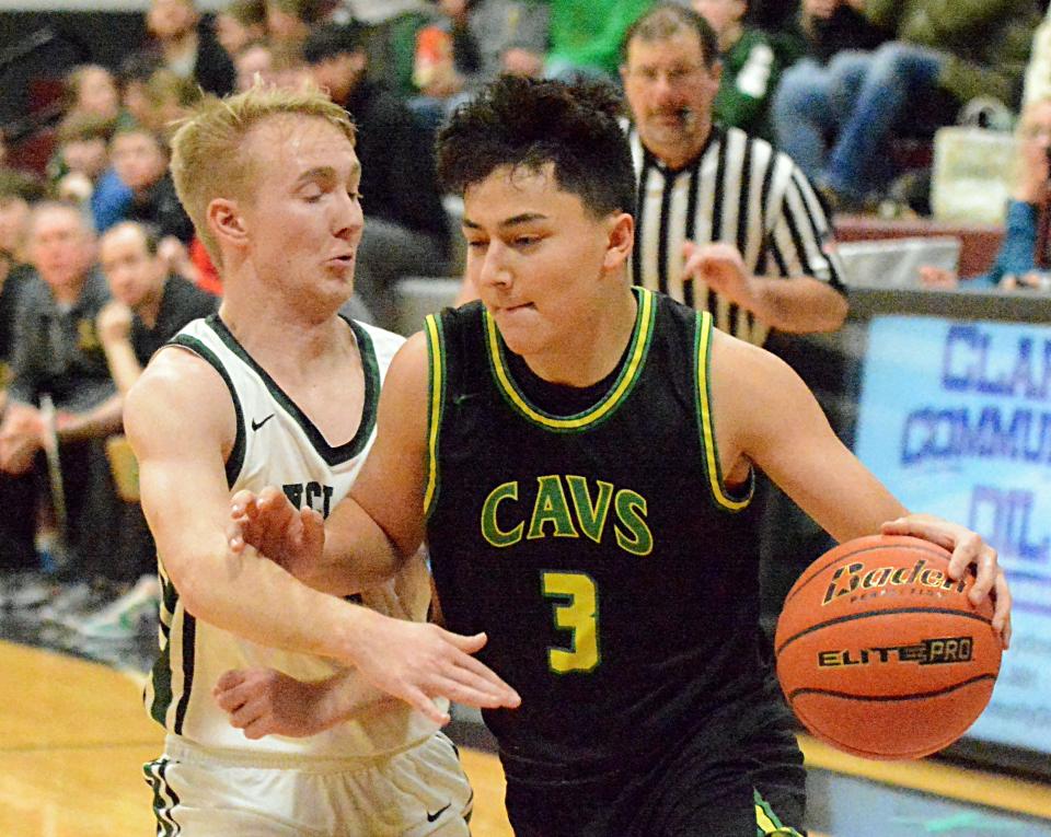 Aberdeen Roncalli's Maddox Miller drives against Clark-Willow Lake's Trey Huber during their Northeast Conference high school basketball doubleheader on Thursday, Jan. 19, 2023 in Clark.