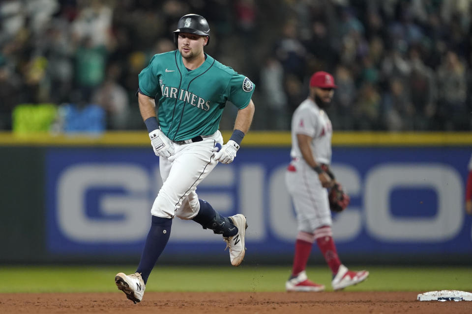 Seattle Mariners' Cal Raleigh rounds the bases after he hit a solo home run against the Los Angeles Angels during the second inning of a baseball game, Friday, June 17, 2022, in Seattle. (AP Photo/Ted S. Warren)