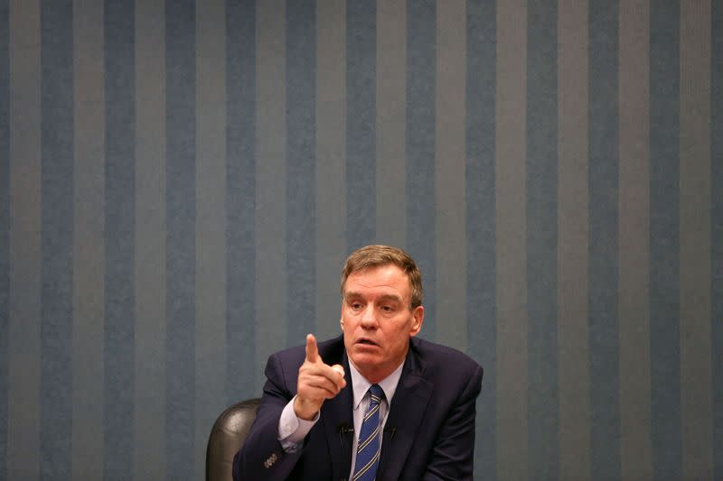 Sen. Mark Warner (D-VA) talks with military families about their hazardous living conditions during a meeting at the Peninsula Workforce Development Office in Newport News